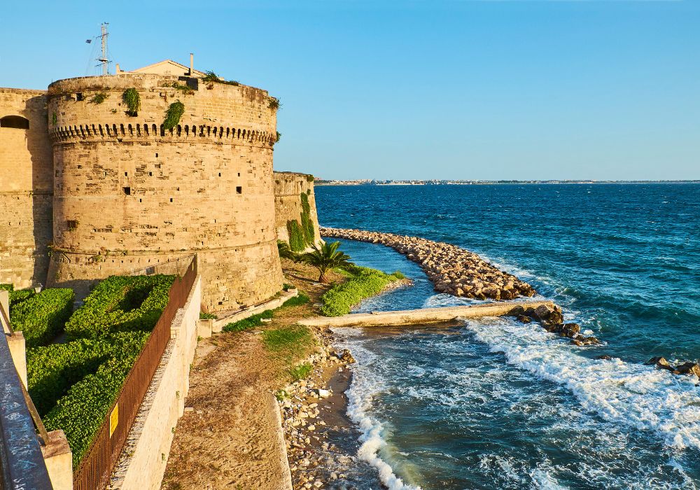 The Aragonese Castle at sunset in Puglia.