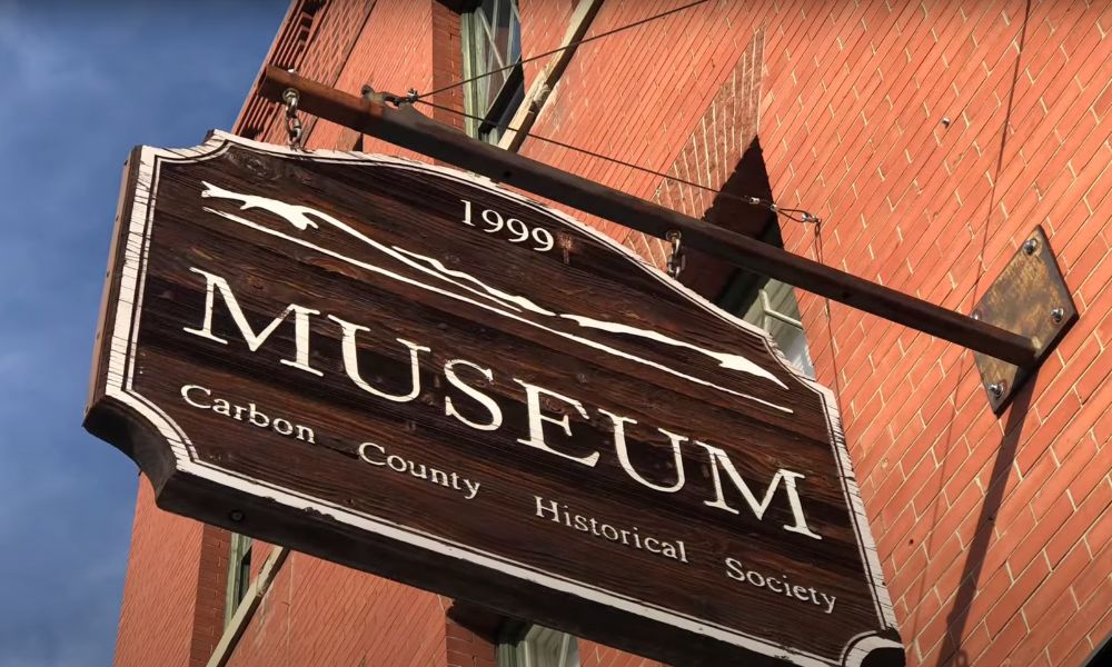 The sign on the outside wall at the Carbon County Historical Society and Museum