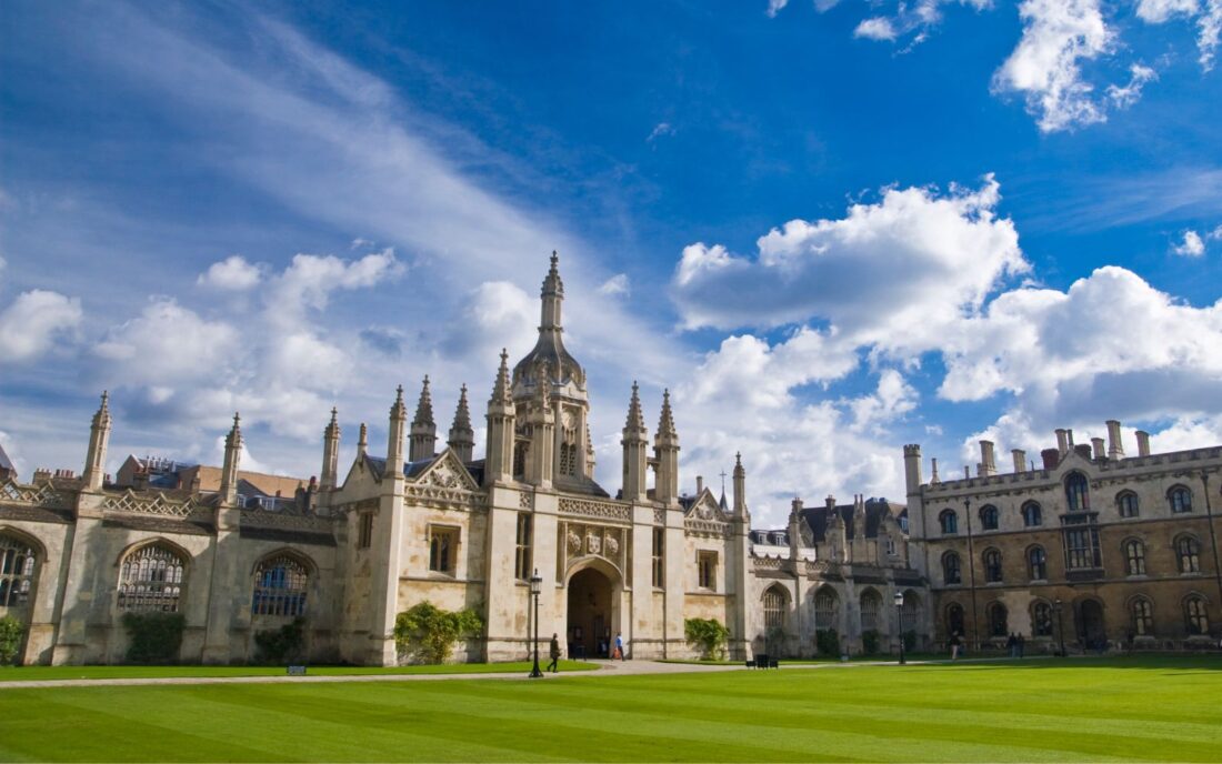The stunning Kings College in Cambridge, England, under bright blue and cloudy skies