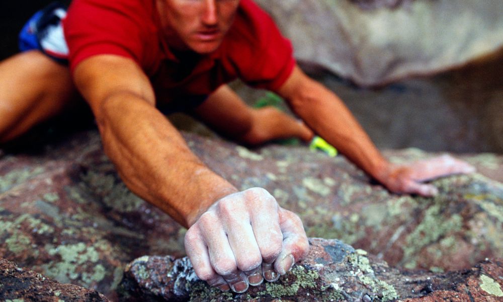 A man practices rock climbing in Bozeman Montana