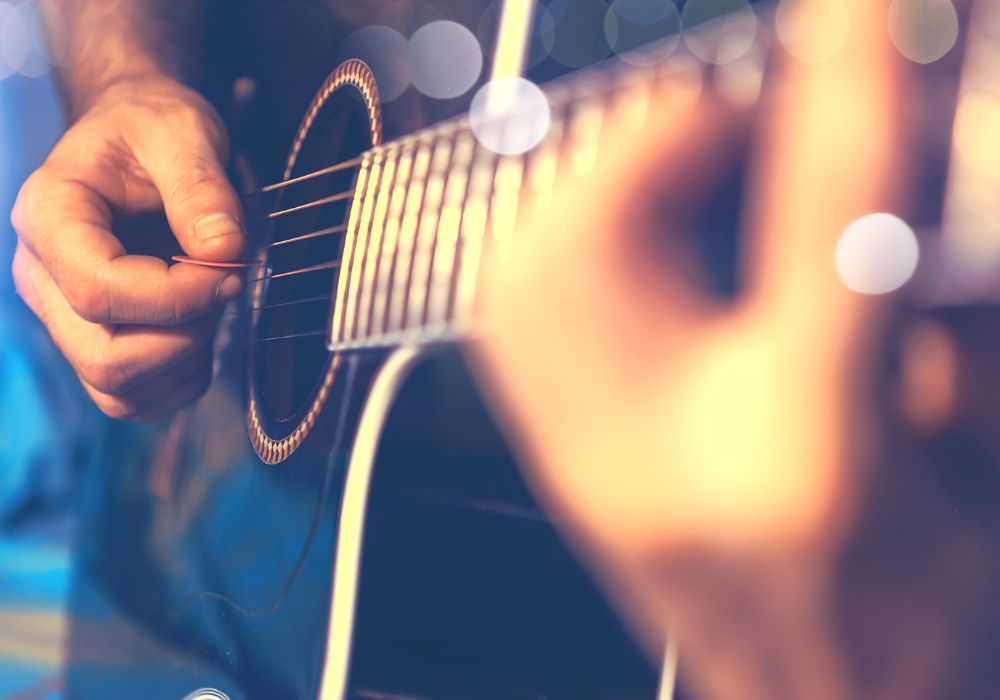 man playing a guitar