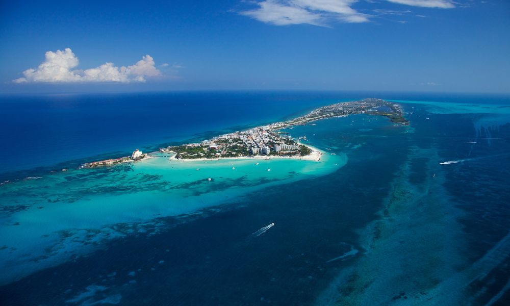 isla mujeres islnad surrounded by blue water and white sand on a sunny day