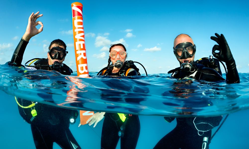 scuba divers in the water in greece