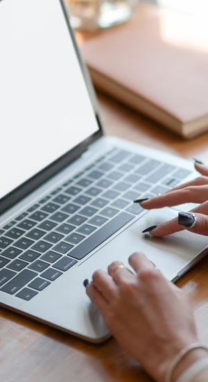 Woman Working on a Macbook Air