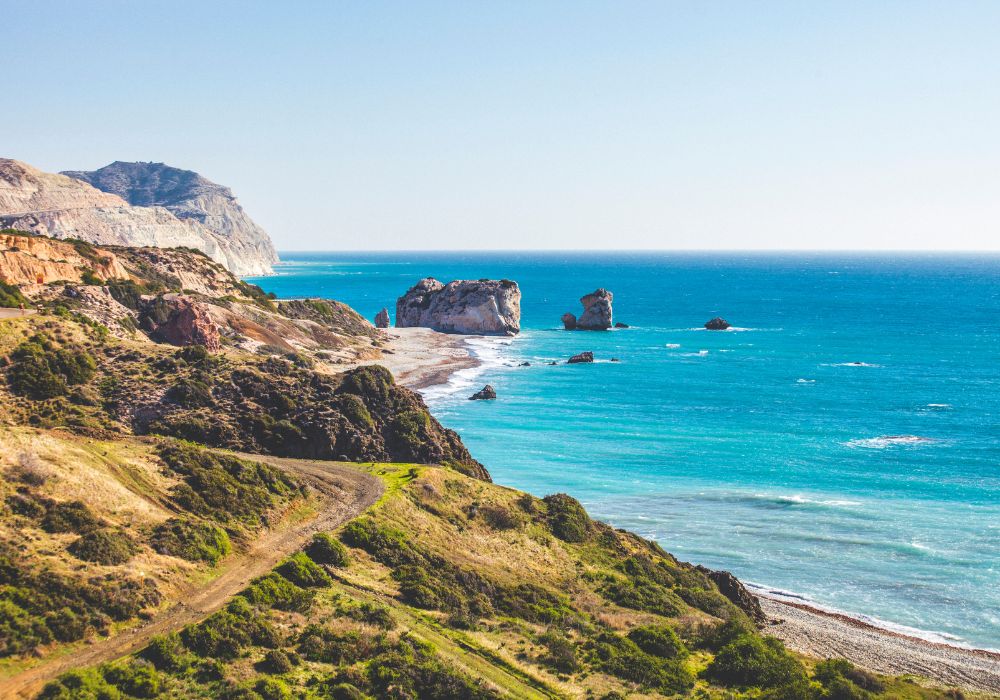 aphrodite hills in cyprus with the sea, and rocks