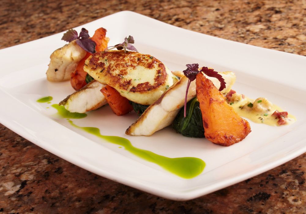 pan-fried seabass served on a ceramic plate