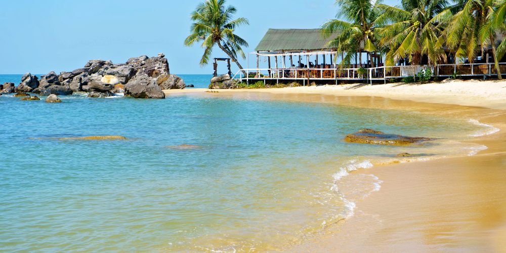 Palm trees, sea and sand in Phu Quoc, Vietnam.