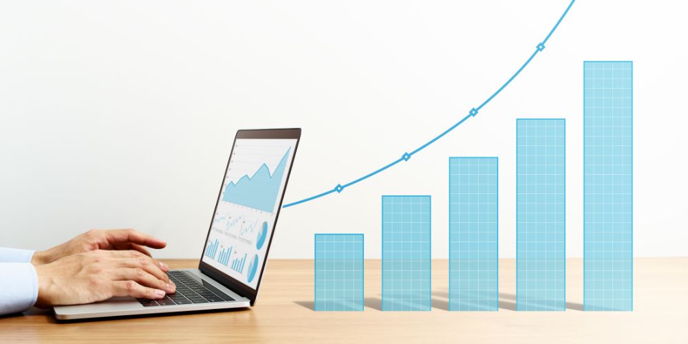 example of a proofreading business. This is a diagram with a laptop and analytics in the laptop expanding out onto the desk beyond the screen.