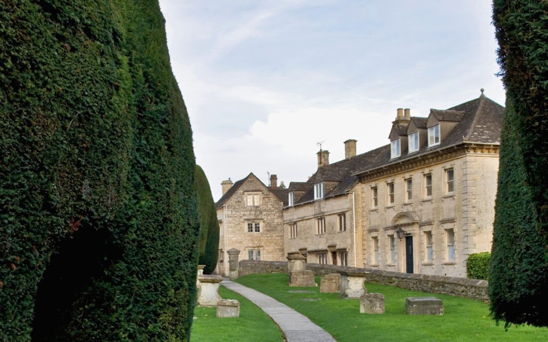Stone houses in the autumn sun in Painswick, Cotswolds.