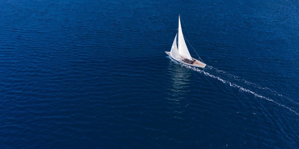 A sailboat in the calm blue sea