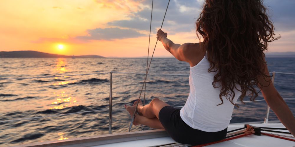 Woman on a sailboat near Naxos, Greece