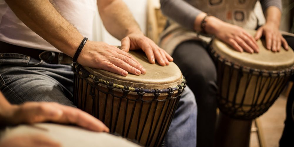 Playing djembes in Asheville's drum circle