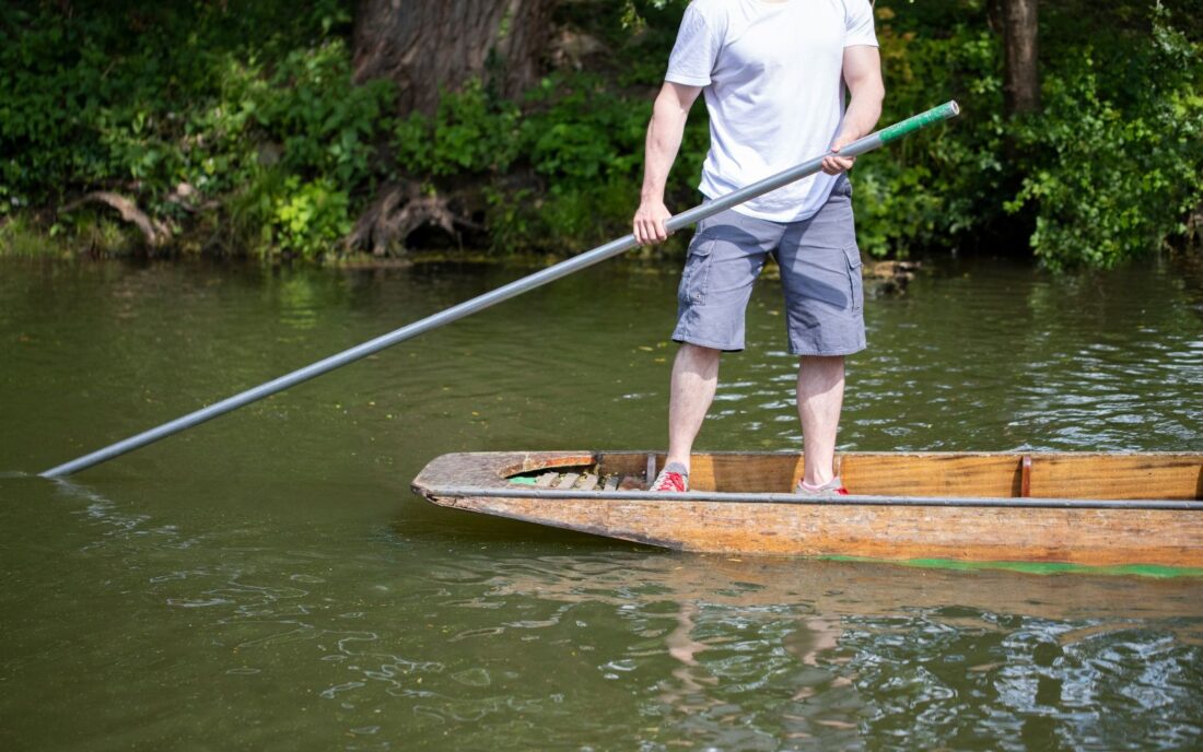 a man punting on the River Cherwell in Oxford