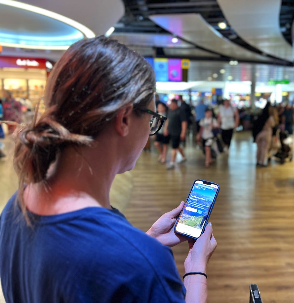 woman using her mobile phone at the airport