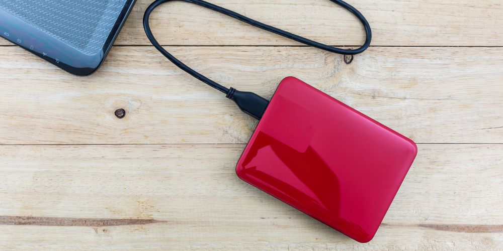 A red external hard drive