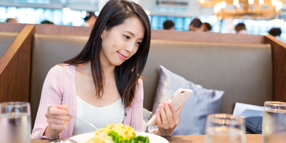 Woman eating lunch in a restaurant