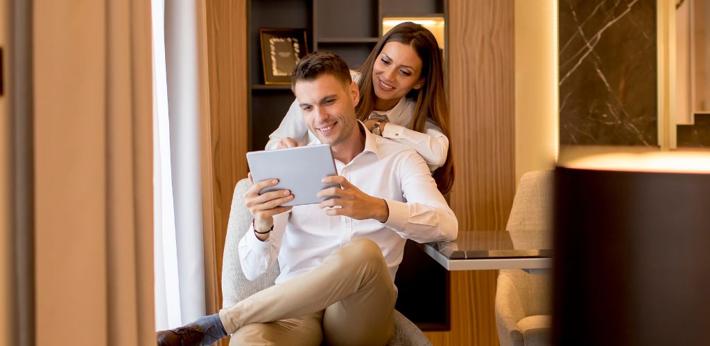 Couple in white in a cozzy room 