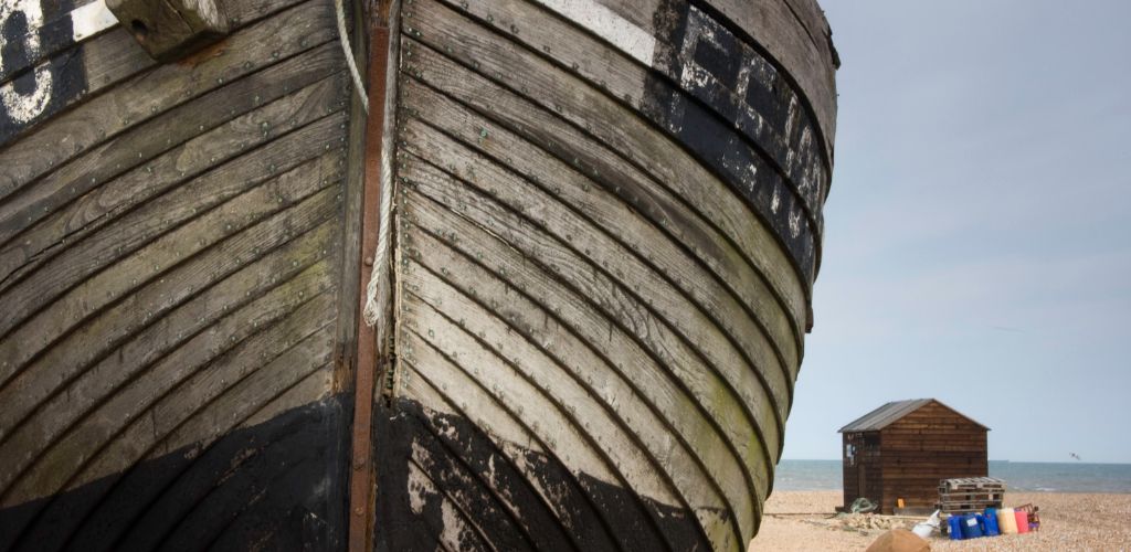 Dungeness Beach with old ship wreck anda cottage