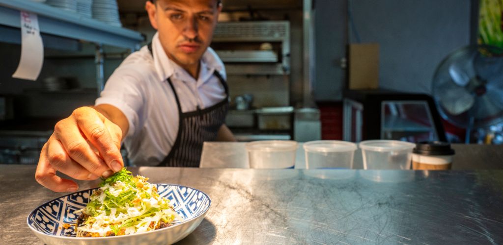 A Mexican Chef preparing a meal