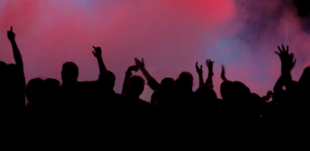 A silhouette of people dancing