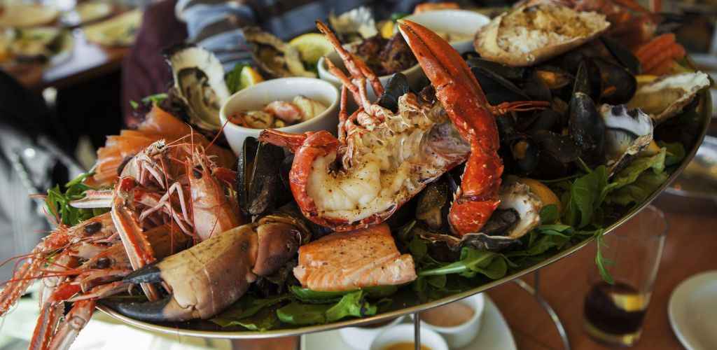 Variety of seafoods composed of crabs, lobsters in a tray