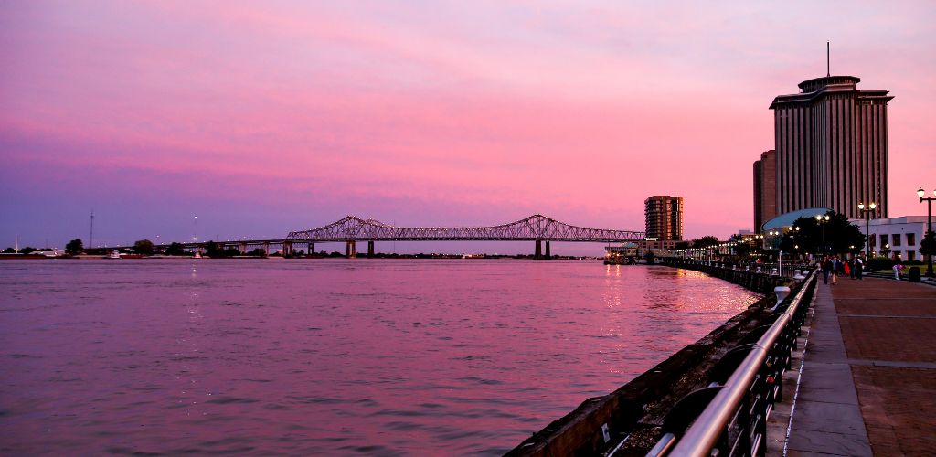 People walking at Sunset Along The Riverfront in New Orleans