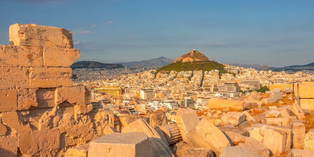A stunning Sunset at Lycabettus Hill in Athens with gold colored rocks