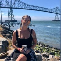 Ashley Fike in front of a bridge