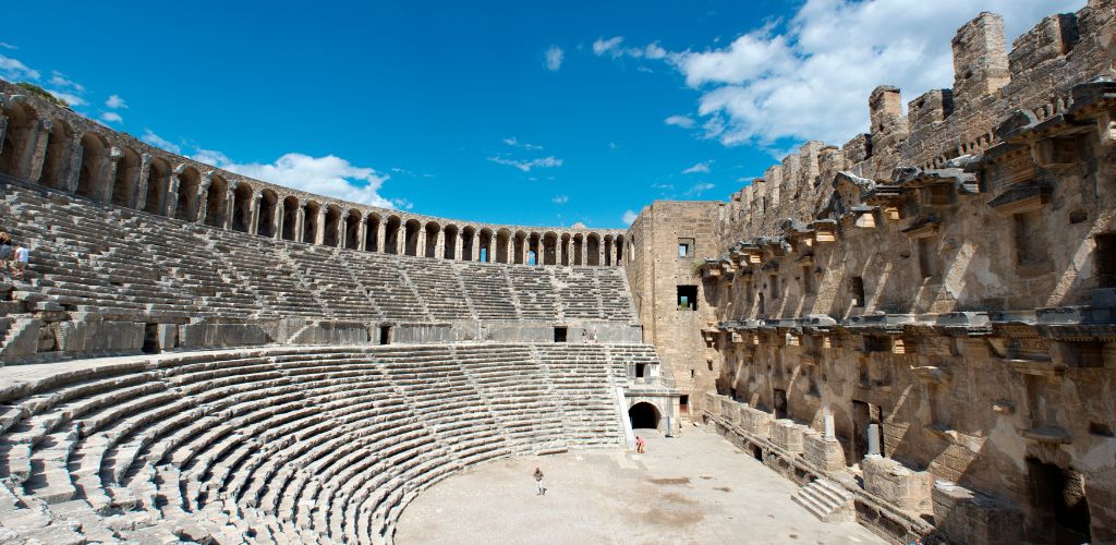 A historic theater in turkey and a clear blue sky. 