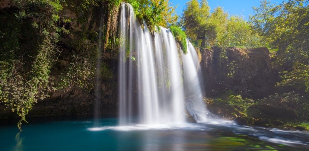 Duden Waterfall Park in Antalya city in turkey. Surrounded by green trees. 