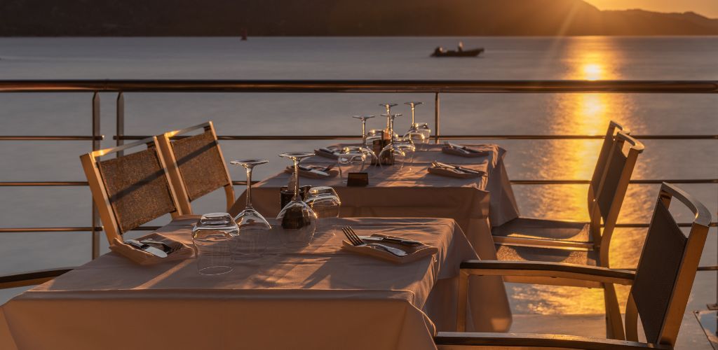 Two tables with a seafront view.