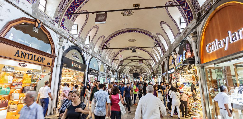 A covered market and crowded people.