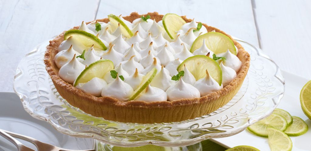 Key Lime cake on a glass plate.