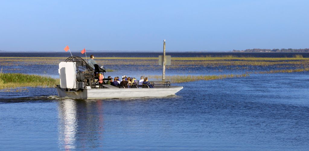 A cool day riding a couple of tourists on an Airboat across Lake. 