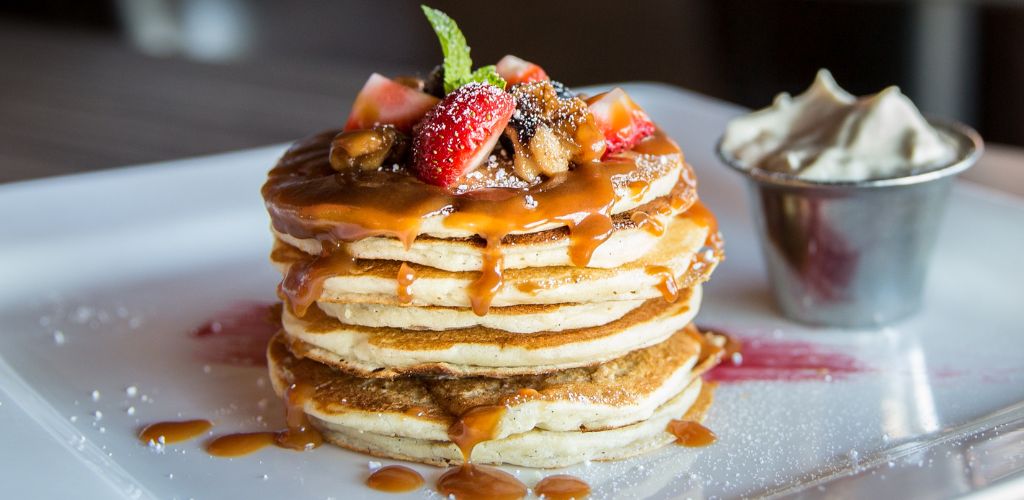 Pancake With Sliced Strawberry and caramel syrup. 