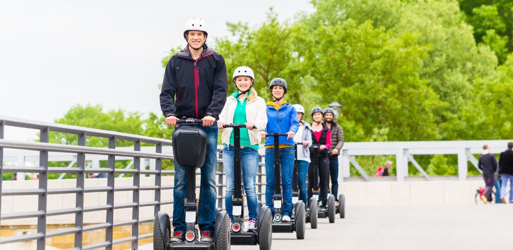 Tourist Group Driving Segway at Sightseeing Tour