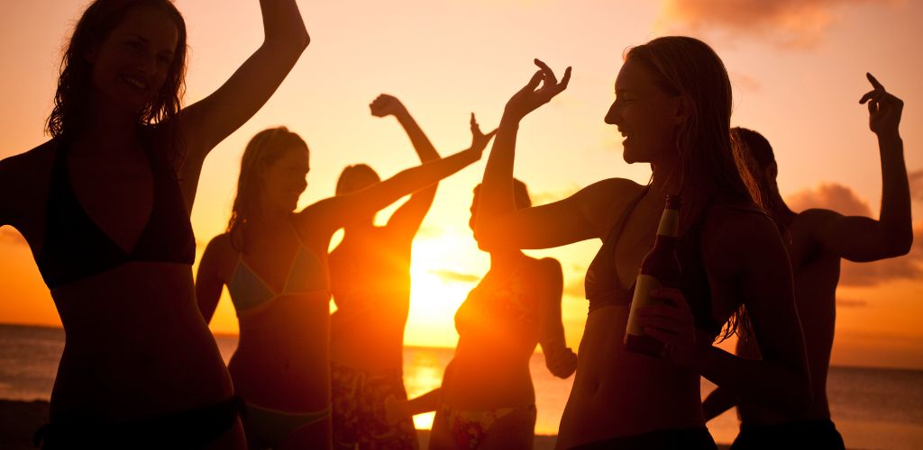 silhouette of  girls partying in the beach