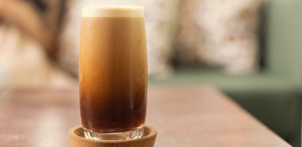 Cold brew or Nitro Coffee drink in the glass with bubble foam