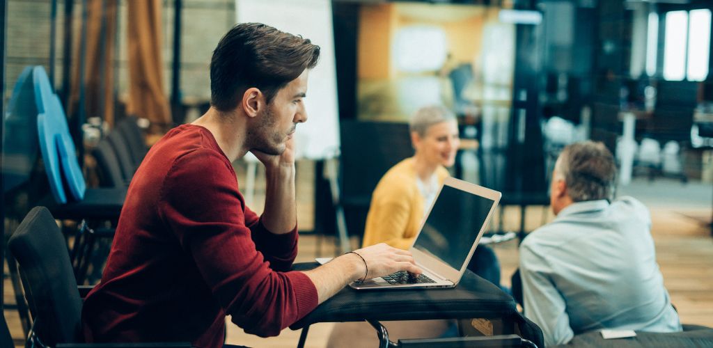 A focused freelancer in a co working space