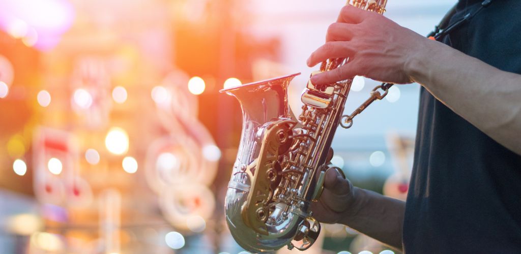 International jazz day and World Jazz festival. Saxophone, music instrument played by saxophonist player musician in fest.