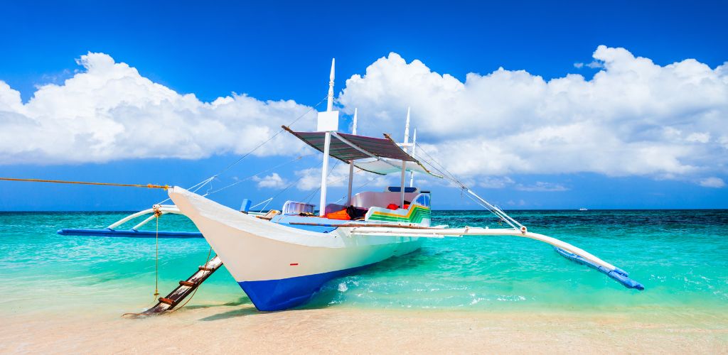 A rental boat parked on the beach shore 