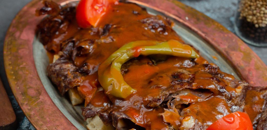 Traditional Turkish Iskender Kebab with Roasted Vegetables