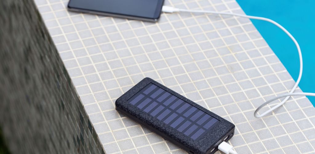 solar power bank charging an iphone gift for digital nomad