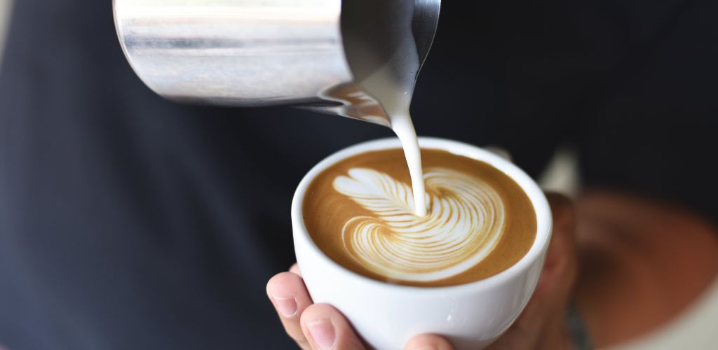 latte coffee flat white with latte art in leaf design