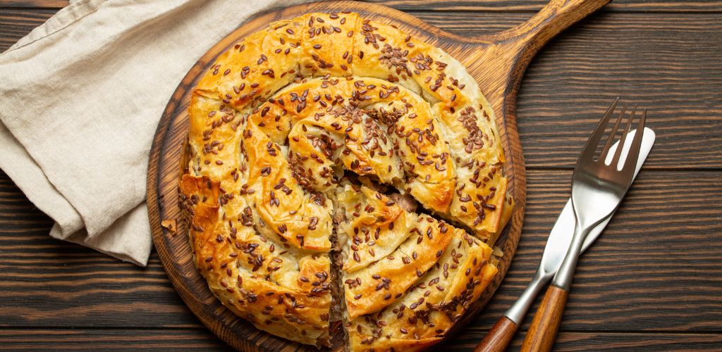 Burek, a traditional Croatian dish with knife and fork 